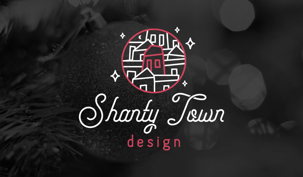 Shanty Town Design Logo on dark image background.