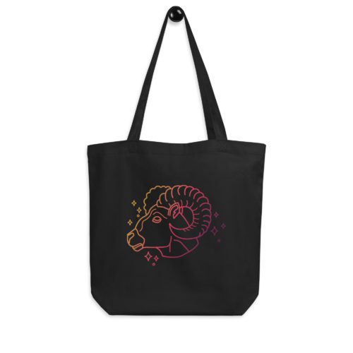 An Aries - Zodiac Eco Tote Bag with a ram design on the front